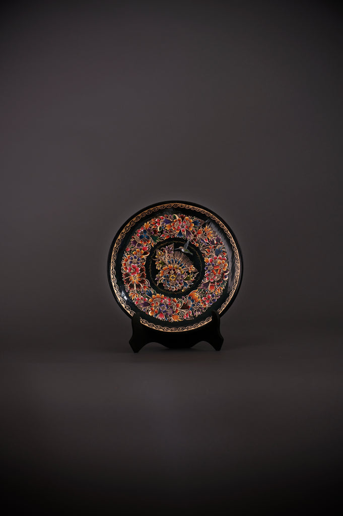 Discover the Mockingbird & Floral Harmony Hand-Painted Mexican Decorative Plate. Crafted from lacquered wood, this artisan masterpiece celebrates vibrant Mexican folk art and nature’s beauty. Authentic Mexican art. Traditional art. Made in Pátzcuaro, Michoacán, Mexico.
