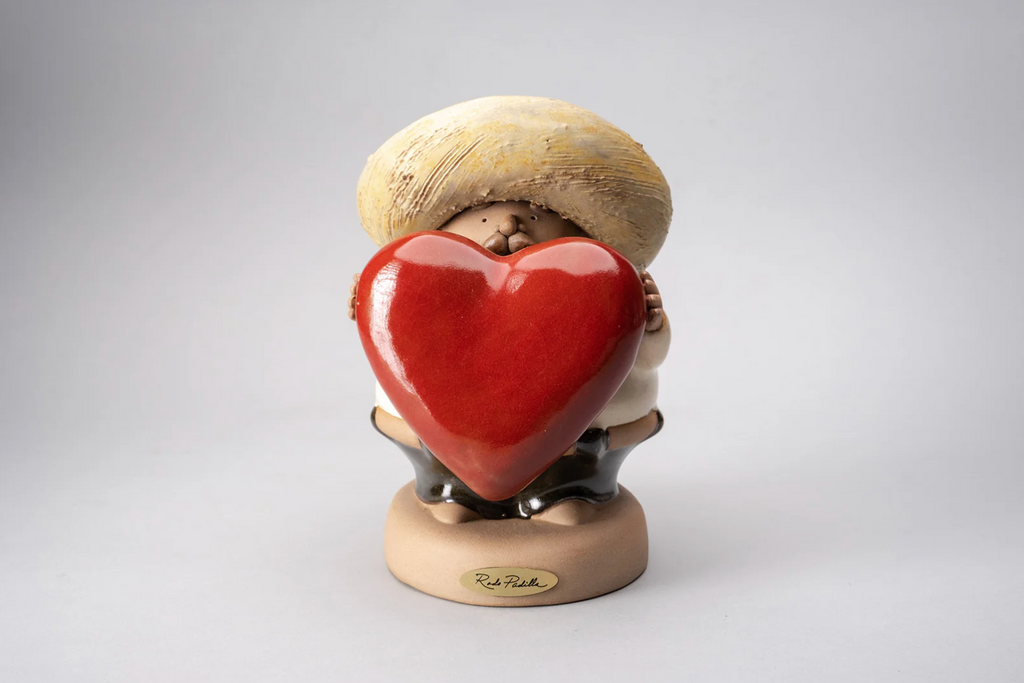 "Handmade ceramic sculpture Charro Puro Corazón by Rodo Padilla featuring a Mexican charro holding a red heart – artisan decor from Jalisco, Mexico" 27 x 9 x 24 cm (approx. 10.6 x 3.5 x 9.4 inches)

