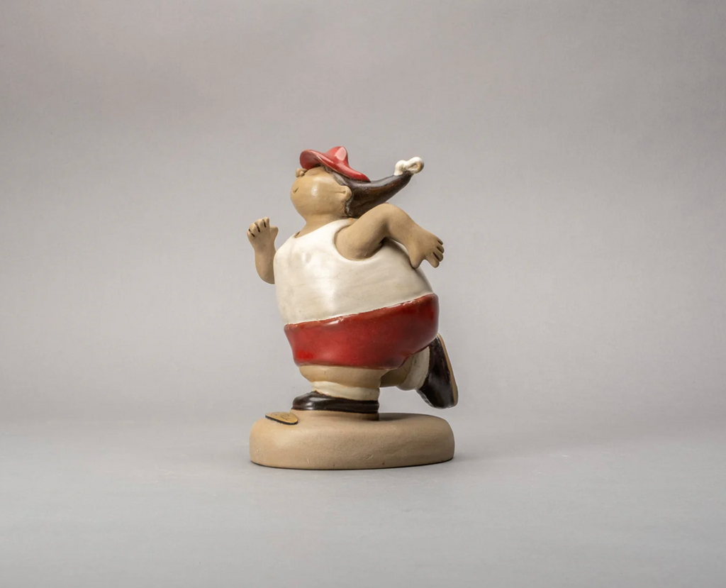 Handmade ceramic sculpture of a joyful chubby female jogger in blue and orange by Rodo Padilla – “Gordita Corredora” 18 x 13 x 14 cm (approx. 7.09 x 5.12 x 5.51 inches)