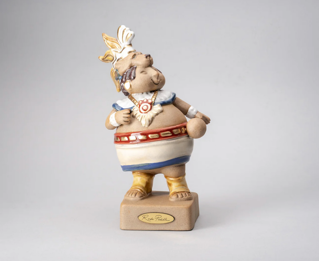 Handmade ceramic sculpture of a smiling Mayan ballgame player wearing a traditional animal headdress – “Mayita – Juego de Pelota” by Rodo Padilla 15 x 8 x 8 cm (approx. 5.91 x 3.15 x 3.15 inches)

