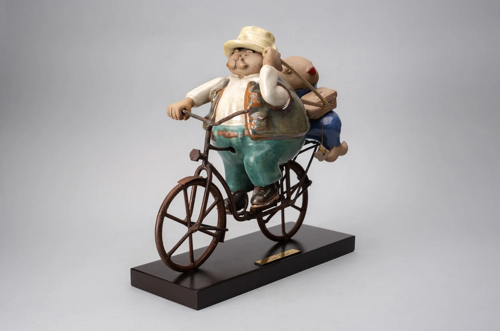 Buena Pesca handmade ceramic sculpture by Rodo Padilla featuring a joyful fisherman celebrating a successful catch, handcrafted and hand-painted in Mexico.
