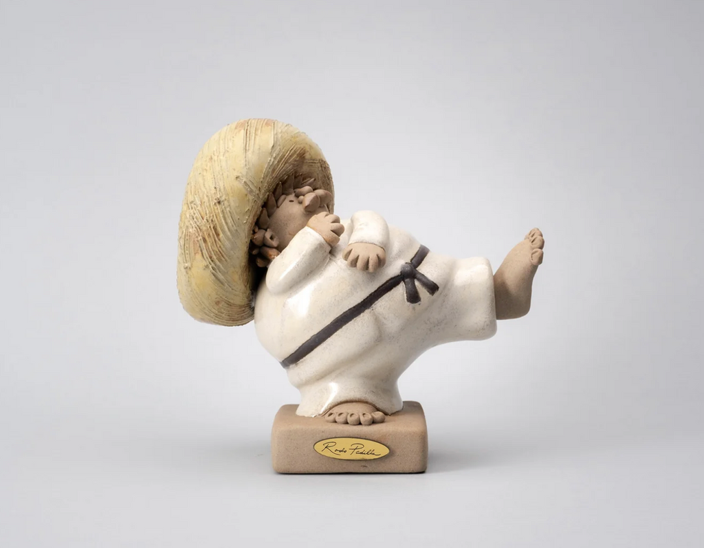 Tae Kwon Do ceramic sculpture by Rodo Padilla featuring a martial arts enthusiast, handmade by artisans in Tlaquepaque, Mexico.
